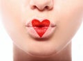 Kissing lips with lovely red make up at the heart