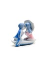 Kissing lovers. Ceramic figurine. Royalty Free Stock Photo