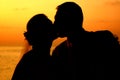 Kissing at sunset Royalty Free Stock Photo