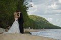 Kissing wedding couple on beach Royalty Free Stock Photo