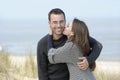 Kissing young couple at the beach