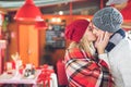 Kissing young couple in cafe Royalty Free Stock Photo
