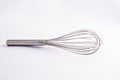 Kitche whisk or egg beater isolated on white background; sensation of fresh and clean kitchen