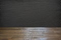 Empty wooden tabletop and black slate chalckboard for display or montage your products. Royalty Free Stock Photo