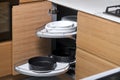 Kitchen access mechanism Magic corner for Blind Corner Cabinets. Solution for a kitchen corner storage in cupboard Royalty Free Stock Photo