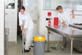 Kitchen aids cleaning restaurant kitchen Royalty Free Stock Photo