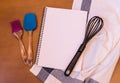 Kitchen baking utensils and empty notebook Royalty Free Stock Photo