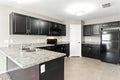 Kitchen with a black refrigerator and a black stove Royalty Free Stock Photo