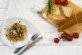 Kitchen board with ingredients for an Italian pasta meal and the Royalty Free Stock Photo