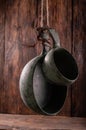 Kitchen bowls for food hung against a wooden wall