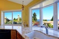 Kitchen cabinet with granite tops and beautiful window view