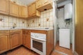 Kitchen with Castilian-style furniture in gloss varnished pine wood Royalty Free Stock Photo