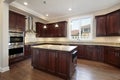 Kitchen with cherry wood cabinetry Royalty Free Stock Photo