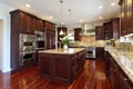 Kitchen with cherry wood cabinetry Royalty Free Stock Photo