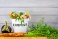 Kitchen compost bucket containing kitchen food waste with home grown vegetables Royalty Free Stock Photo