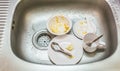 Kitchen conceptual image. Dirty sink with many dirty dishes.