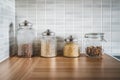 Kitchen containers and food in glass jars. Ingredient organization and sustainable storage. Pasta, oatmeal, rice and muesli.