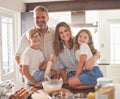 Kitchen, cooking and family in portrait with breakfast food together and smile for support, love and care. Happy parents Royalty Free Stock Photo