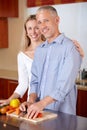 Kitchen, cooking and portrait of couple with vegetables for healthy dinner, lunch and ingredients. Retirement, marriage Royalty Free Stock Photo