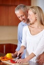 Kitchen, cooking and senior couple with vegetables for healthy dinner, lunch and supper. Retirement, marriage and mature Royalty Free Stock Photo