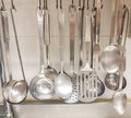 Kitchen cooking utensils on steel rack