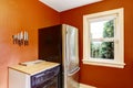 Kitchen corner with bright red walls and steel refrigerator Royalty Free Stock Photo