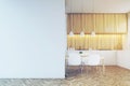 Kitchen counter, dining table and a blank wall, toned