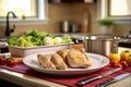 kitchen counter scene with alabama chicken plate, and cutlery