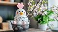 On the kitchen counter, a wire basket holds a white hen figurine and brown and white eggs Royalty Free Stock Photo