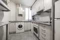 Kitchen with cream colored gloss wood cabinets with granite countertops