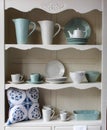 Kitchen cupboard with dinnerware Royalty Free Stock Photo