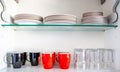 Kitchen cupboard with disheslike plates, cups and glasses