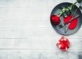 Kitchen cutlery on plate with gift and red rose. Happy Valentines Day Royalty Free Stock Photo