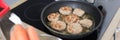 In kitchen, cutlets are fried in frying pan