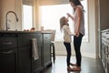 This kitchen is for dancing. a happy mother dancing with her little girl in the kitchen at home. Royalty Free Stock Photo