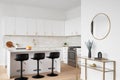 A kitchen detail with white cabinets, picket tile backsplash, and cozy decor. Royalty Free Stock Photo