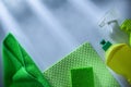 Kitchen dishcloth bottles sprayer sponge on white surface Royalty Free Stock Photo