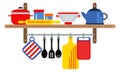 Kitchen equipment on wooden shelves. Flat cooking tools