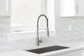 A kitchen faucet detail with a mosaic tile backsplash. Royalty Free Stock Photo