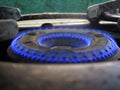 Kitchen gas stove burner flaming in dark blue color flames. Nice to see it in closeup angle. Royalty Free Stock Photo