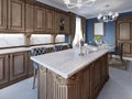 Kitchen with granite island and cherry wood cabinetry Royalty Free Stock Photo