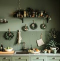 Kitchen With Green Cabinets and Wreaths on Wall