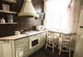 Kitchen interior in bright colors stove refrigerator chairs