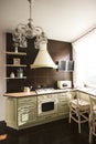 Kitchen interior in bright colors stove refrigerator chairs