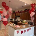 Interior of kitchen decorated for Valentine\'s Day with heart-shaped balloons Royalty Free Stock Photo