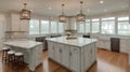 Kitchen Interior with Island, Sink, Cabinets, and Hardwood Floors in New Luxury Home.