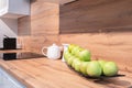 Kitchen interior, modern kitchen with many apples on a platter, breakfast concept, kitchen background, concept of healthy eating,