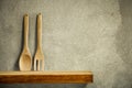 Kitchen tools on wooden shelf. Copy empty space for your decoration and products. Beige brown retro wall background. Royalty Free Stock Photo