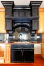 Kitchen island and stove custom wood cabinets. New luxury home interior. Royalty Free Stock Photo
