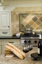Kitchen island with wine and baguette french bread Royalty Free Stock Photo